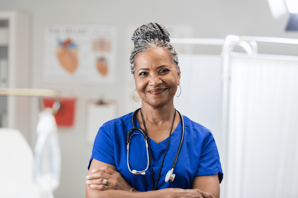 African-American female medical professional wearing scrubs and stethoscope