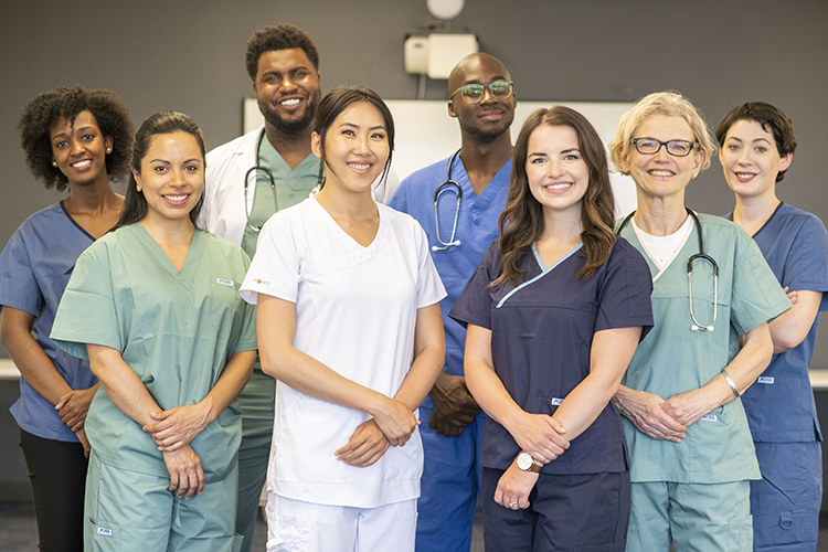Diverse group of nurses smiling at camera
